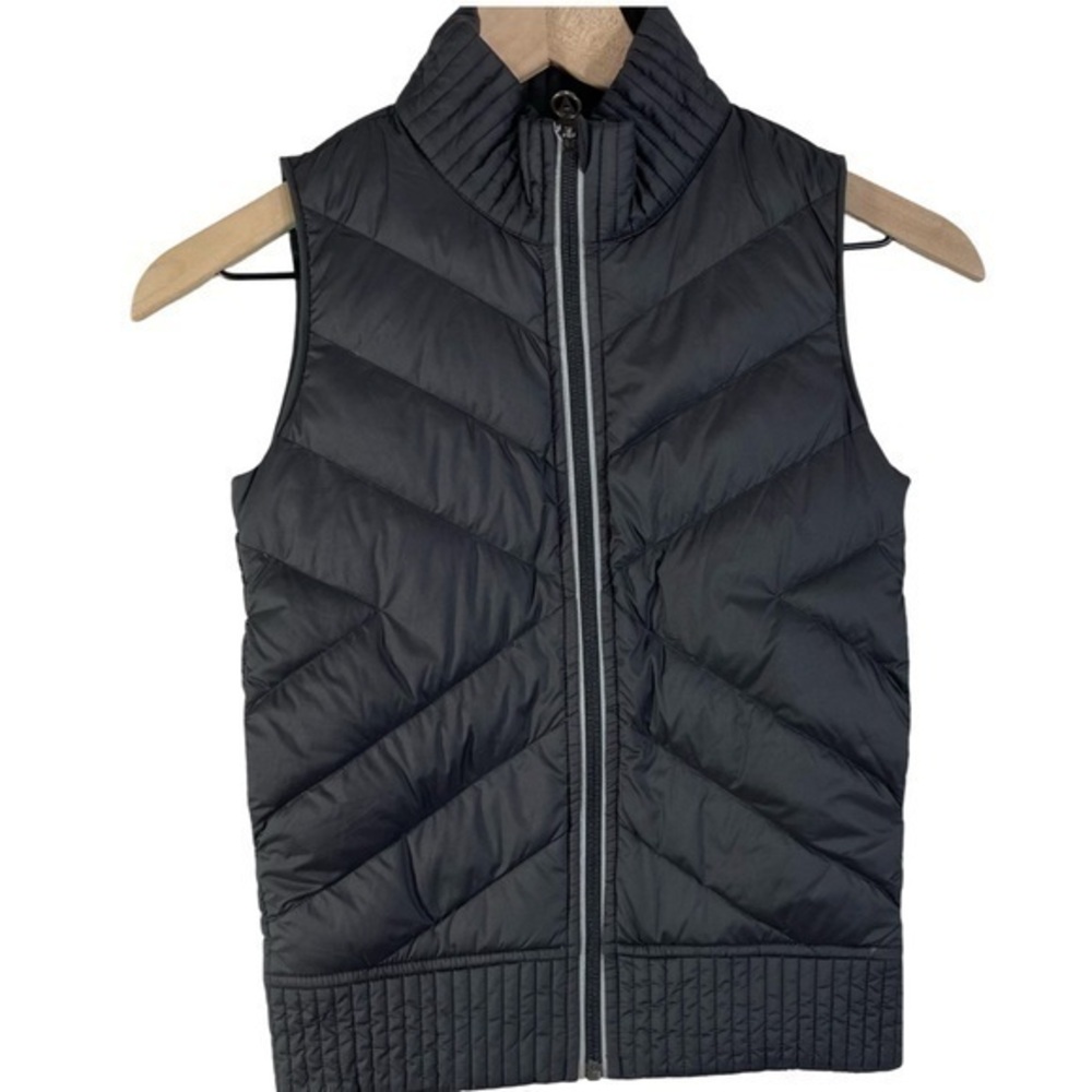 Ivivva black puffer vest with teal lining Girls size 7 Color Black